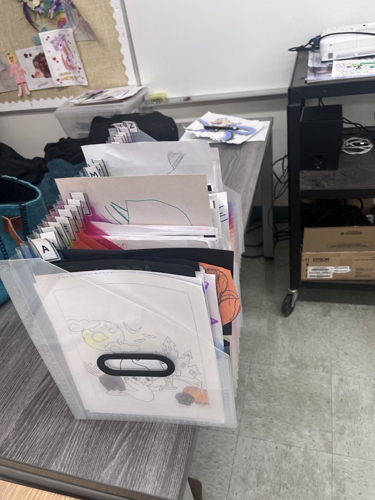 Student work organized in labelled classroom folders